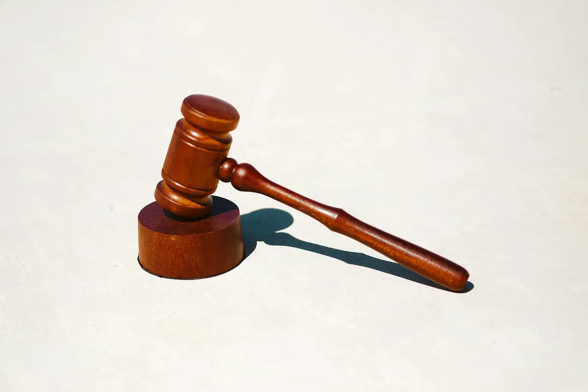 Wooden gavel on a surface.